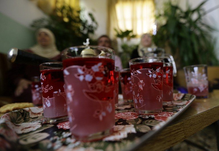 REFRESHING DRINK. Syrians serve rose water, made from damask roses, in the village of Marah, on May 11, 2016. Photo by Louai Beshara/AFP  
