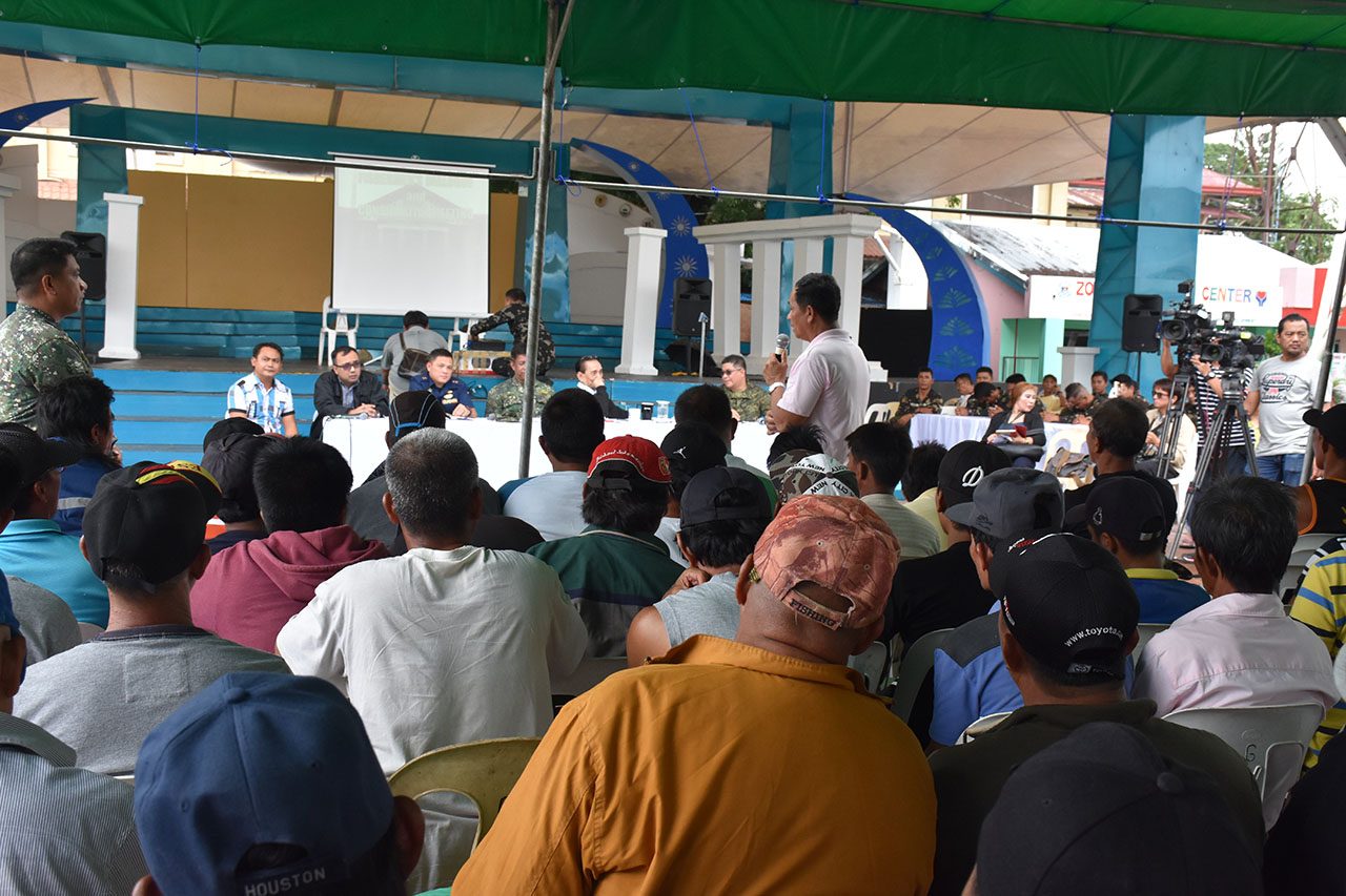 'STOP CHINA.' Fishermen from Zambales ask the government to put a stop to abusive practices of the China Coast Guard in Panatag Shoal. Photo by Randy Datu   