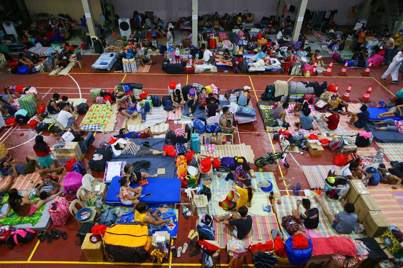 LIMBO. Stranded Filipinos camped outside of the Northport Passenger terminal are brought to the Philippine Ports Authority multi-purpose hall in Tondo, Manila on July 1, 2020 after their ferry trips bound for Visayas region were cancelled due to a surge of COVID19 cases. Photo by Inoue Jaena/Rappler 