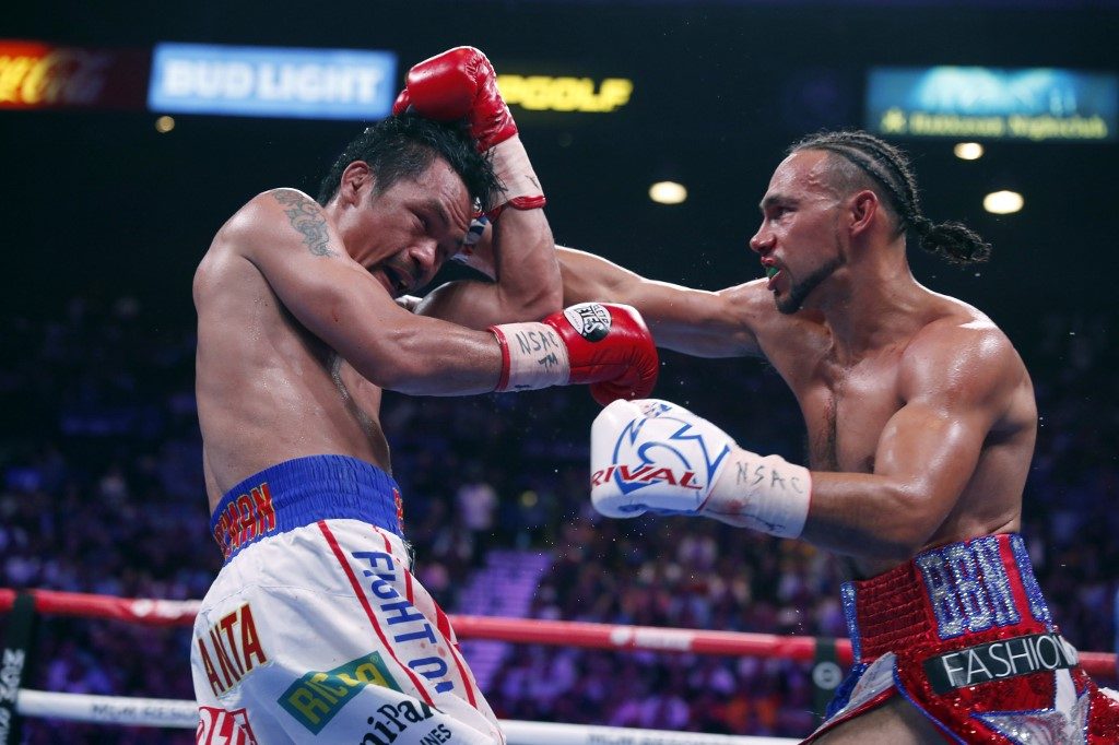 Jolted by many head punches, Pacquiao won’t fly home yet