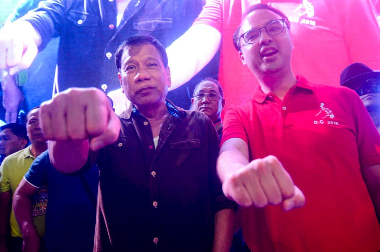 IRON FISTS? Davao Mayor Rody Duterte and Senator Alan Peter Cayetano declare their tandem for the top posts in 2016 elections.  Photo by Alecs Ongcal/Rappler  