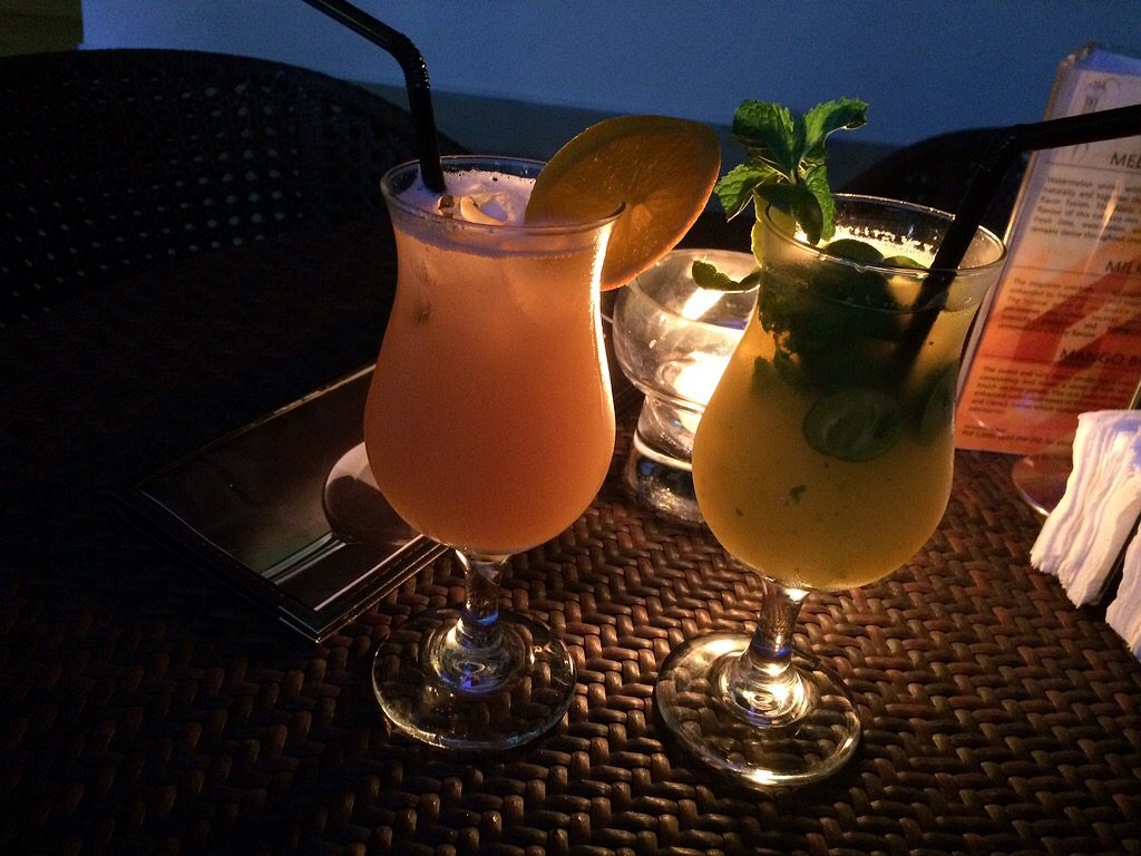 BOTTOMS UP! Beat the heat with The District's Rum Punch and Mango Mojito. Perfect for sipping while watching the sun set.    