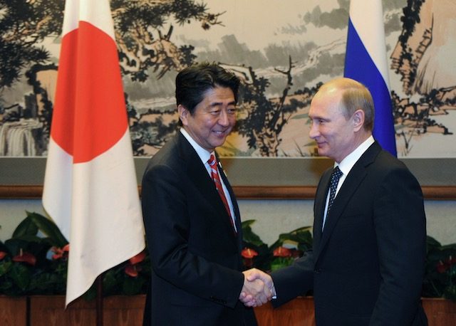 Japan’s Abe visits Putin looking to warm ties despite island dispute