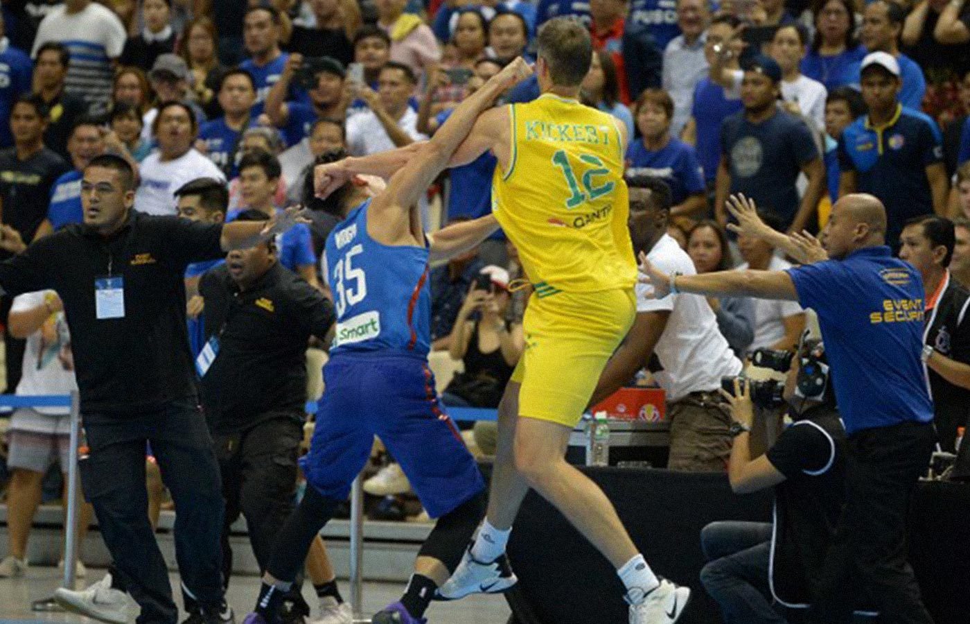EMBARRASSING. The Philippine and Australian basketball officials apologize for the incident that brought disgrace to the sport. Photo by Ted Aljibe/AFP 