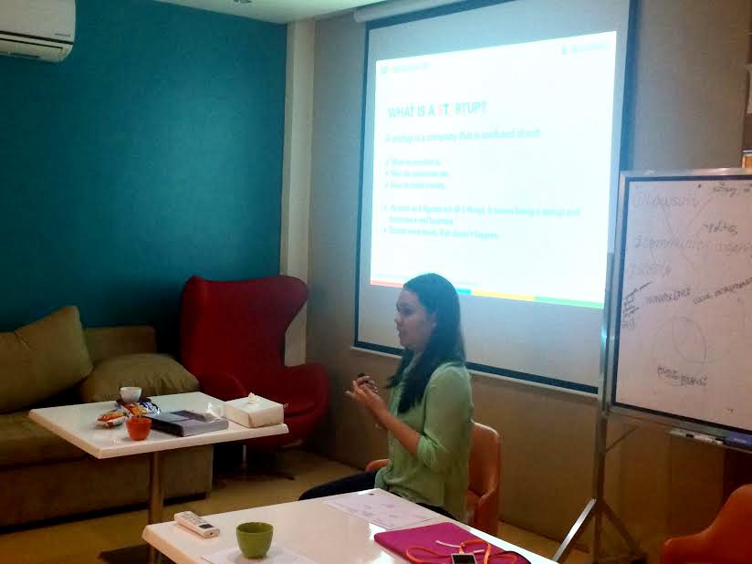 TEACHING. Brenda Valerio of IdeaSpace teaching scholars about the Lean Model Canvas. Valerio serves as the Incubation Specialist for IdeaSpace and her startup won 3rd place at Startup Weekend Manila 2014. 