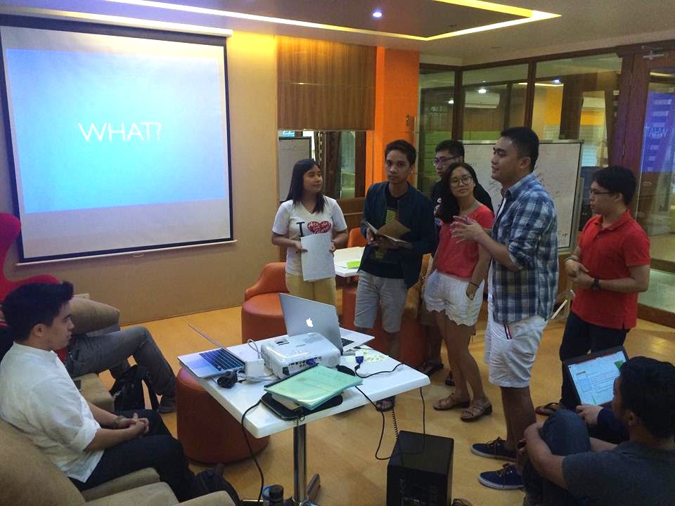 PITCHING. From left: Richard Dacalos and scholars Johna Mandac, Ryan Gersava, Carlo Cojuangco, Fran Aguilan, Raven Duran, and Ginbert Castillo. Here the scholars pitch their ideas from the exercise to guest speaker Richard Dacalos.  