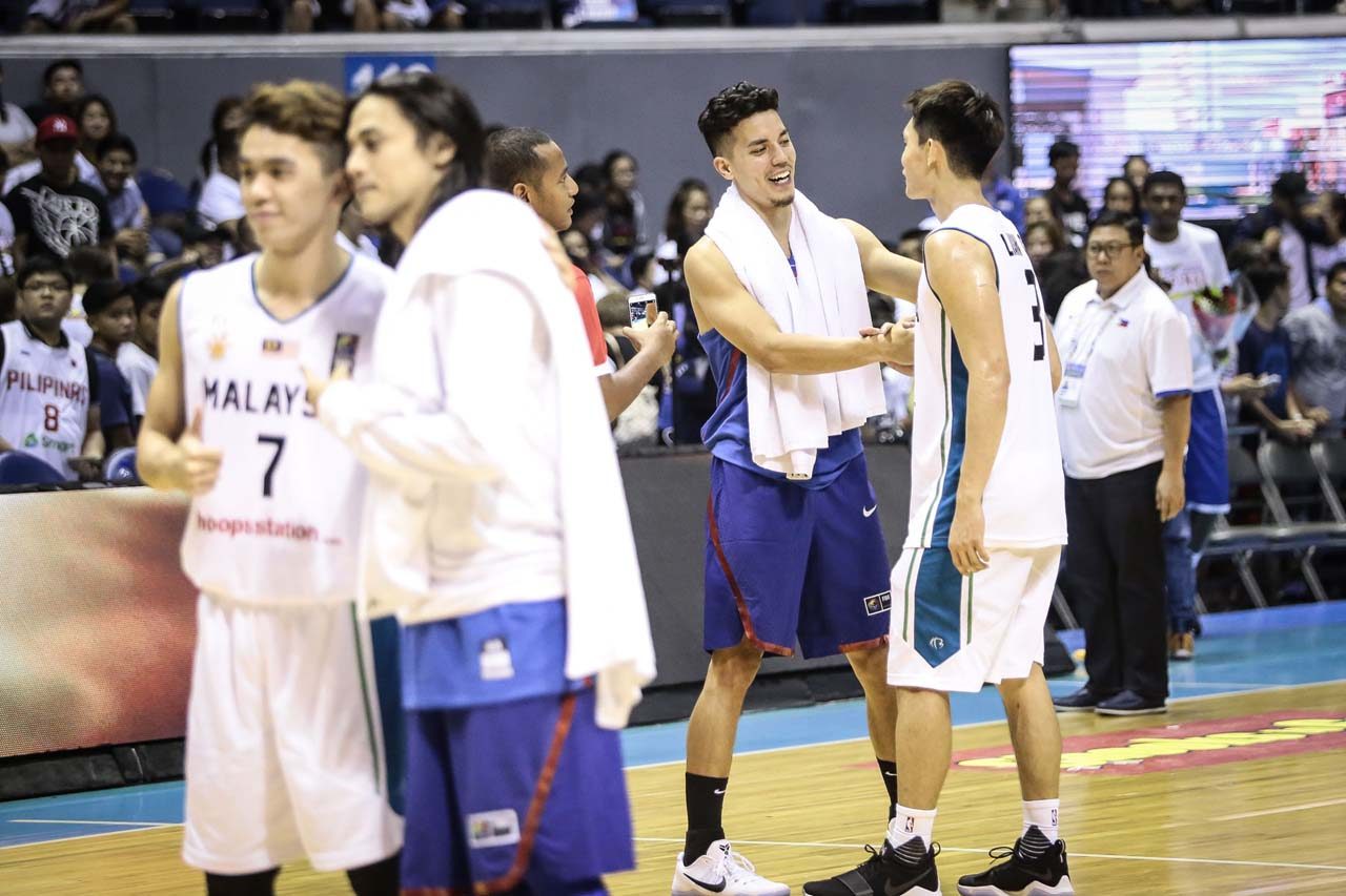 IDOL. On the left hand side of the photo, Terrence Romeo can be seen taking a photo with a Malaysian player sporting blonde hair similar to Romeo's in the past. On the right is Matthew Wright also speaking with his old Malaysia teammate in the ABL. Photo by Josh Albelda/Rappler 
