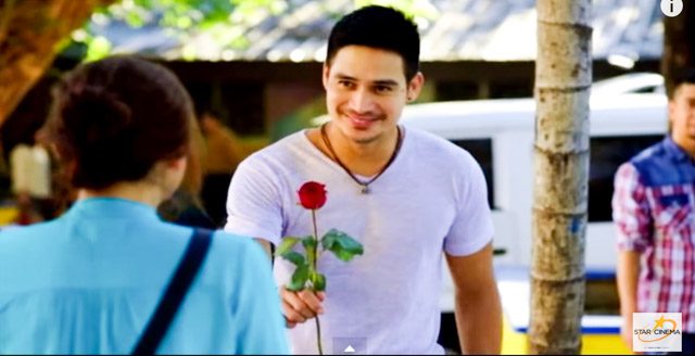 SWEET GESTURES. Gino gives Trixie a rose. Screengrab from YouTube  