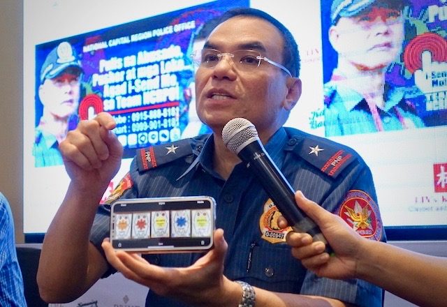 STICKERS PRESENTED. NCRPO chief Guillermo Eleazar shows what the stickers for Oplan Clean Rider would look like during the Pandesal Forum on Friday, July 27. Photo by Rambo Talabong/Rappler 