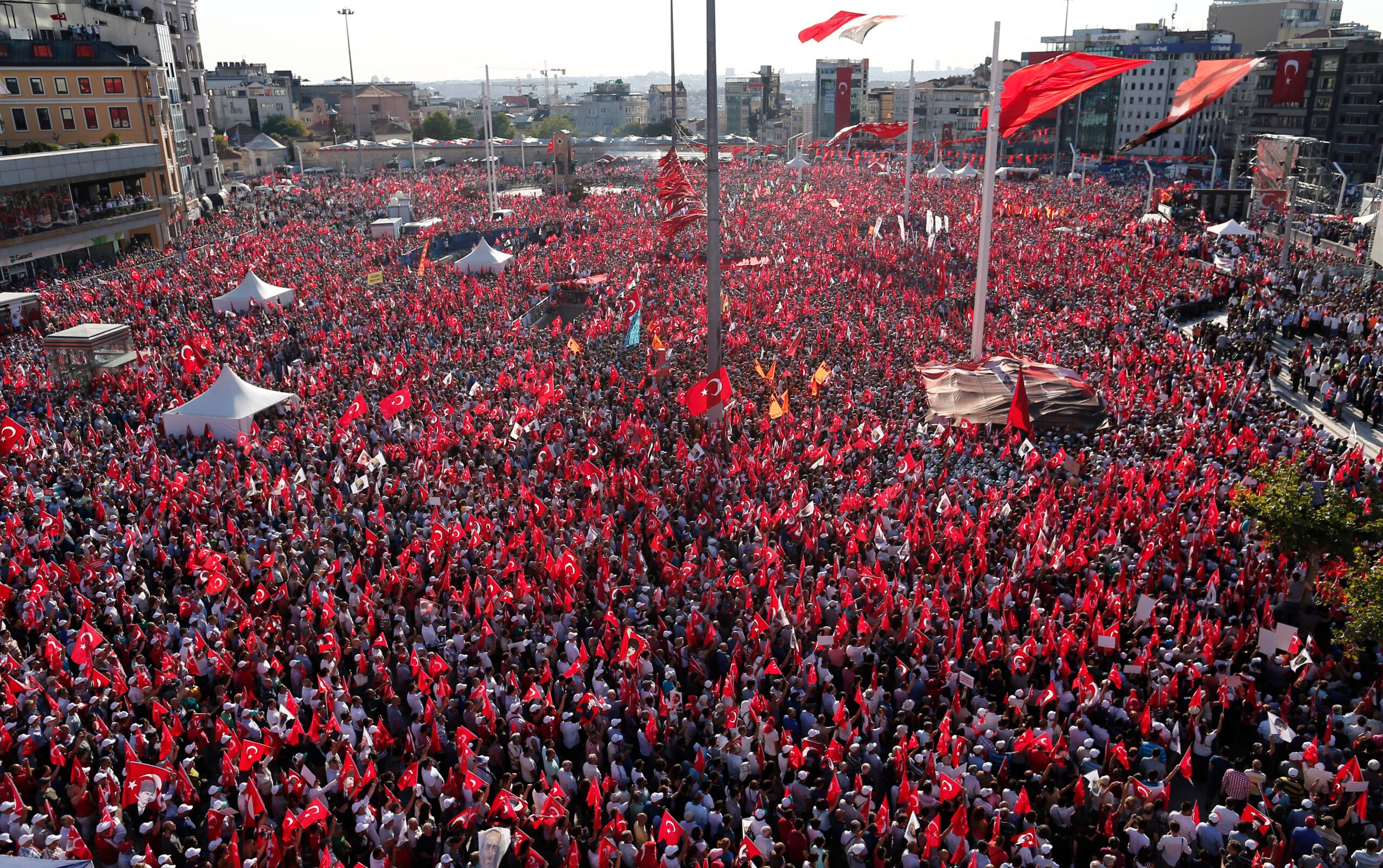 Turks mass to condemn coup amid torture claims