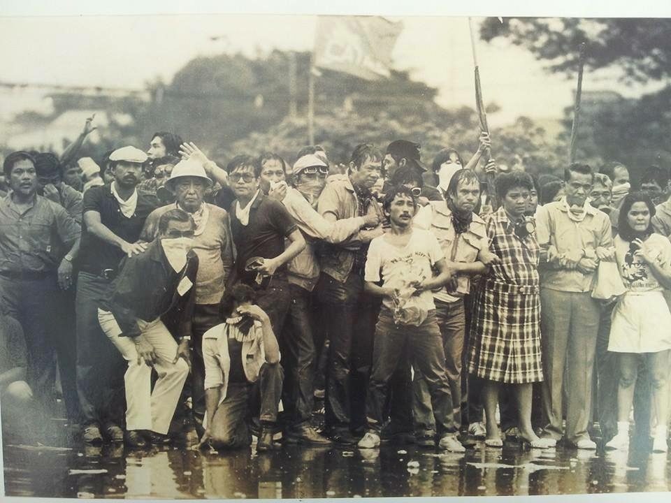 BACK TO THE STREETS. The author (left, wearing a cap) with the the late Lorenzo Tañada and other anti-Marcos activists at the Welcome Rotunda in Quezon City on Sept 25, 1985. Photo courtesy of Ed Garcia 