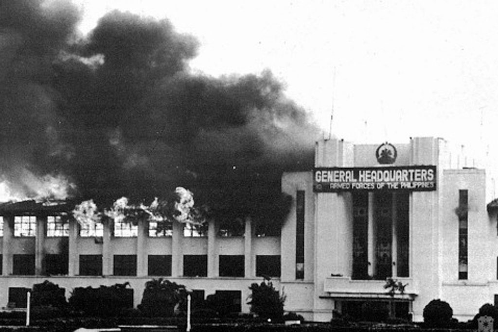 AUGUST 1987 COUP. The headquarters of the Armed Forces of the Philippines in Camp Aguinaldo is bombed by rebel soldiers. Photo courtesy of Malacañang 