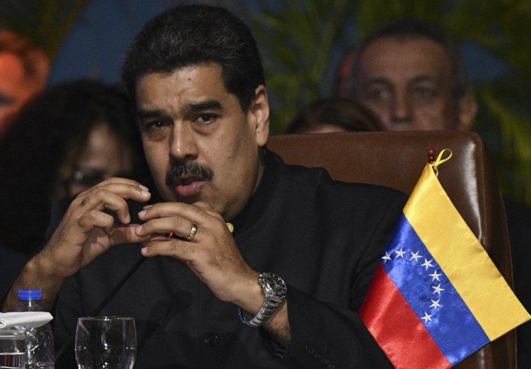 Maduro rallies military support as U.S. backs Venezuela challenger