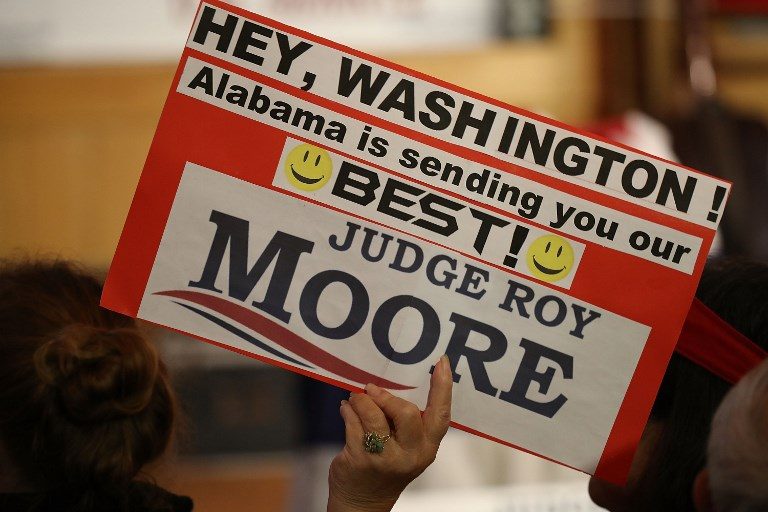 Alabama votes after vicious contest dogged by claims against candidate