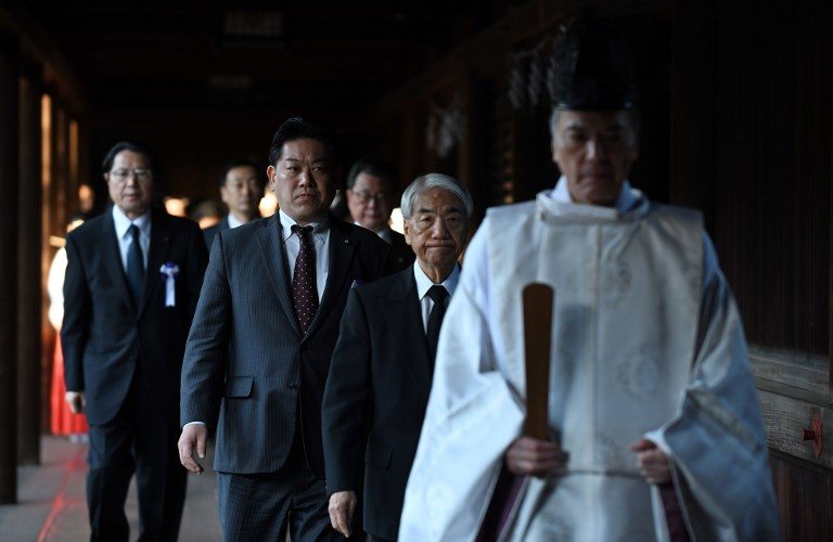 Dozens of Japan MPs visit controversial war shrine