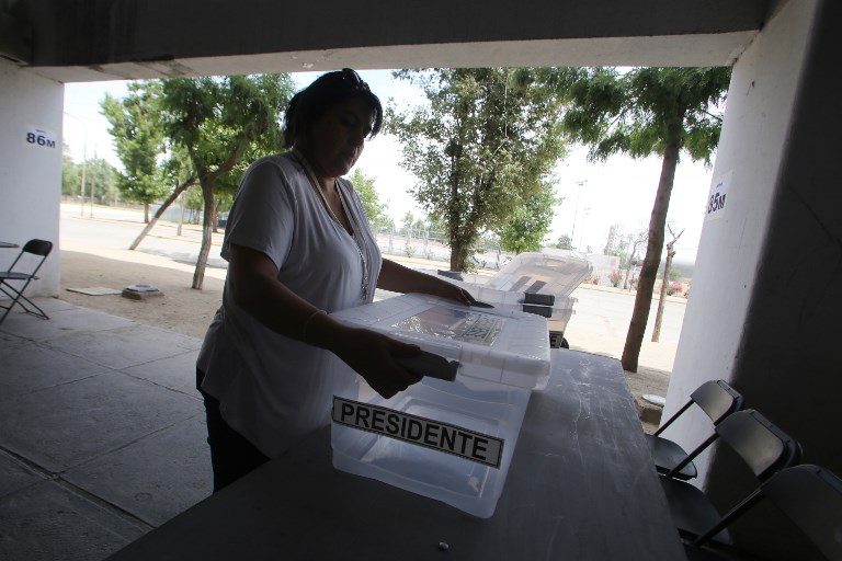 Polls open in uncertain Chile vote