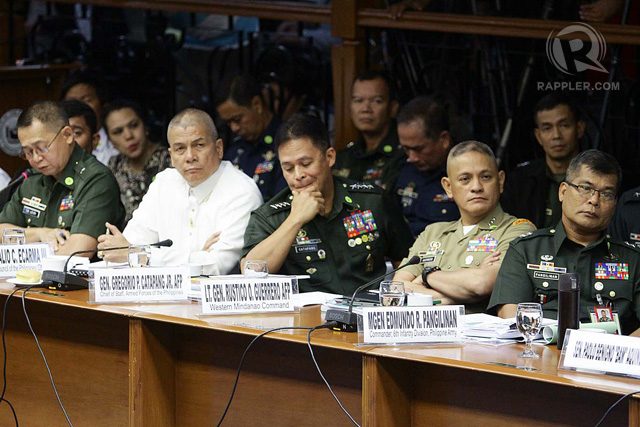 AFP GENERALS. Among those present during a meeting to discuss the possibility of using a precision-guided bomb to target Marwan are AFP chief Gen Gregorio Capatang (center), Major Gen Edmundo Pangilinan (right-most) and Lt Gen Rustico Guerrero (second from right).  