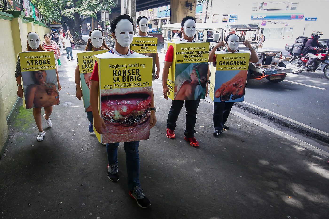 GRAPHIC WARNING. Department of Health employees in cigarette packs with graphic health warning costumes parade around the DOH vicinity in Manila on July 21, 2017, to remind the public of the Nationwide Smoking Ban starting July 23, 2017. Photo by Ben Nabong/Rappler   