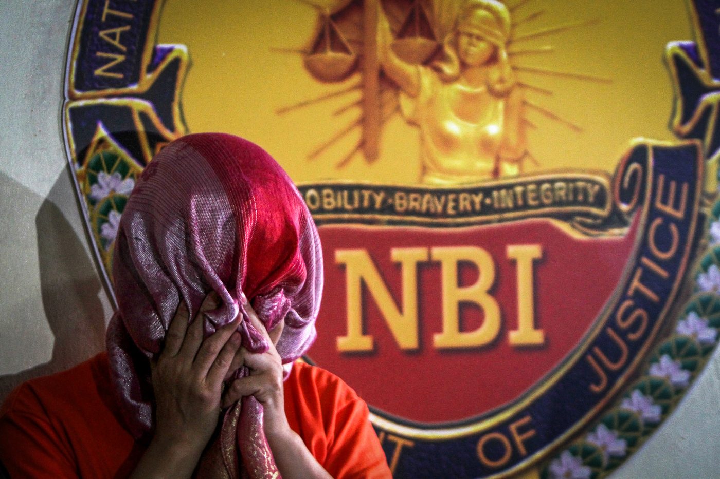 CAUGHT. Members of the NBI-Anti Fraud Division on July 21, 2017, present to media Maria Victoria Lopez, head of Metrobank's Corporate Service Management unit, after her arrest for alleged fraud amounting to at least P900 million. Photo by Inoue Jaena/Rappler   