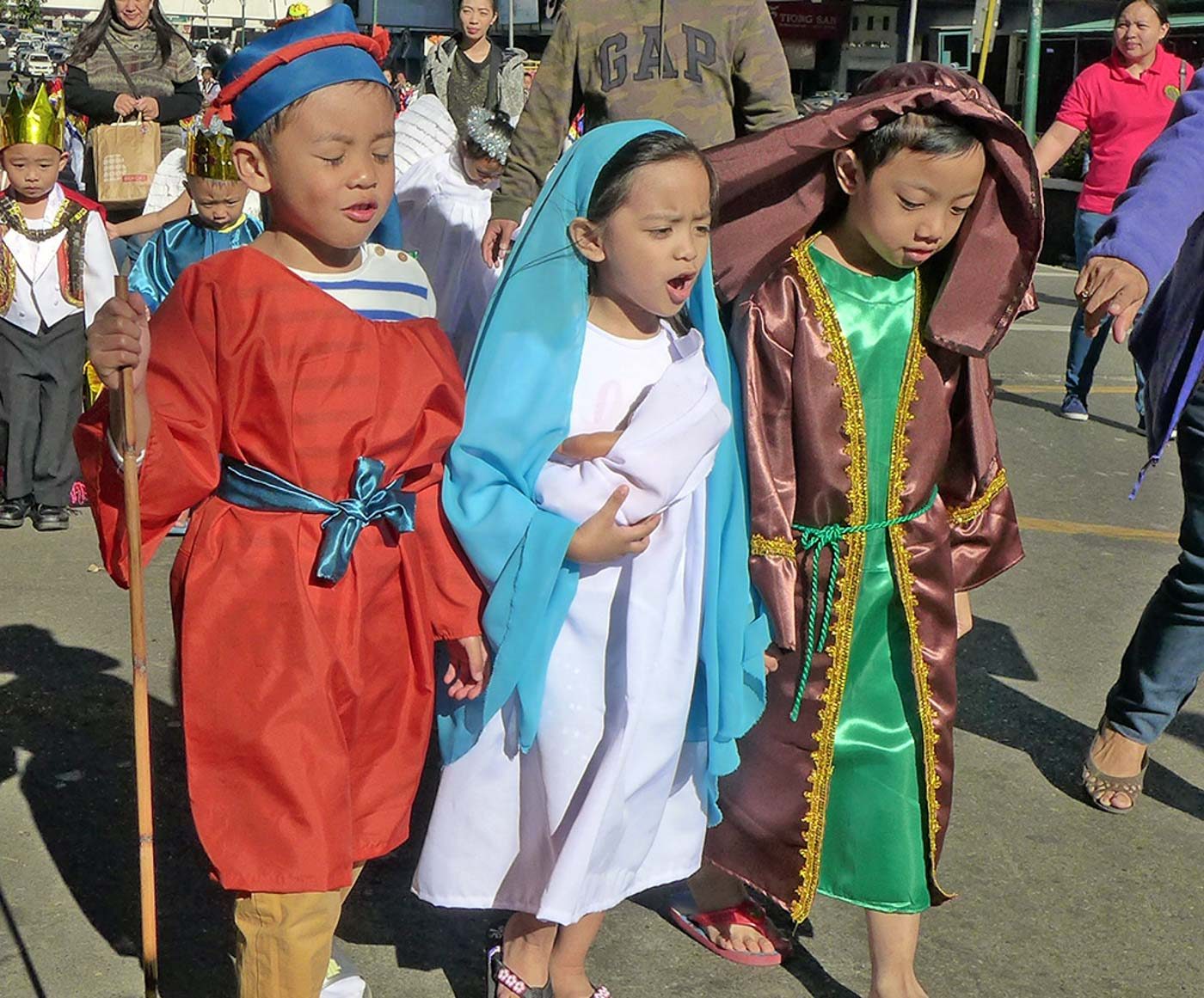 BELEN. Kids dressed up as Mary, Joseph, and one of the shepherds 