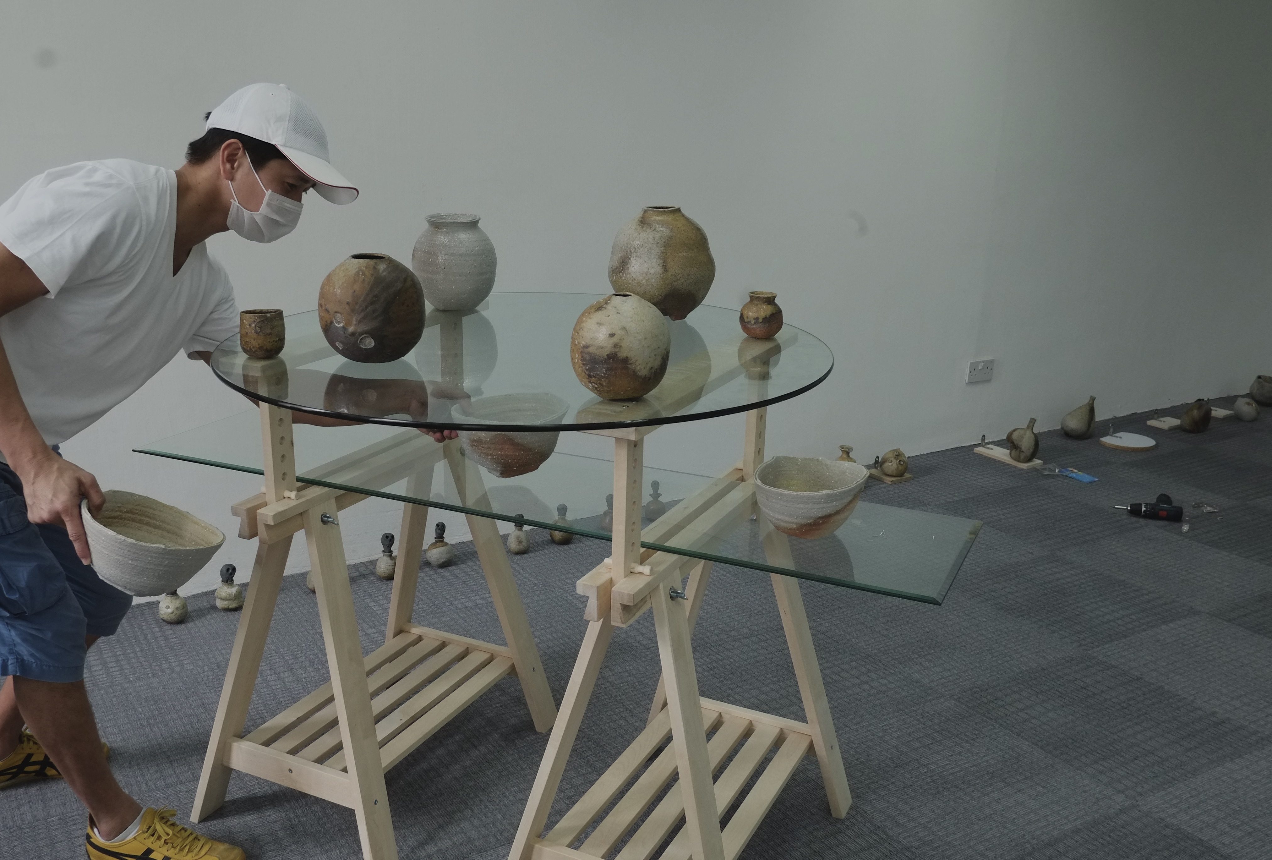 AT WORK. Filipino ceramic artist Pablo Capati III prepares for his solo exhibit in Singapore  