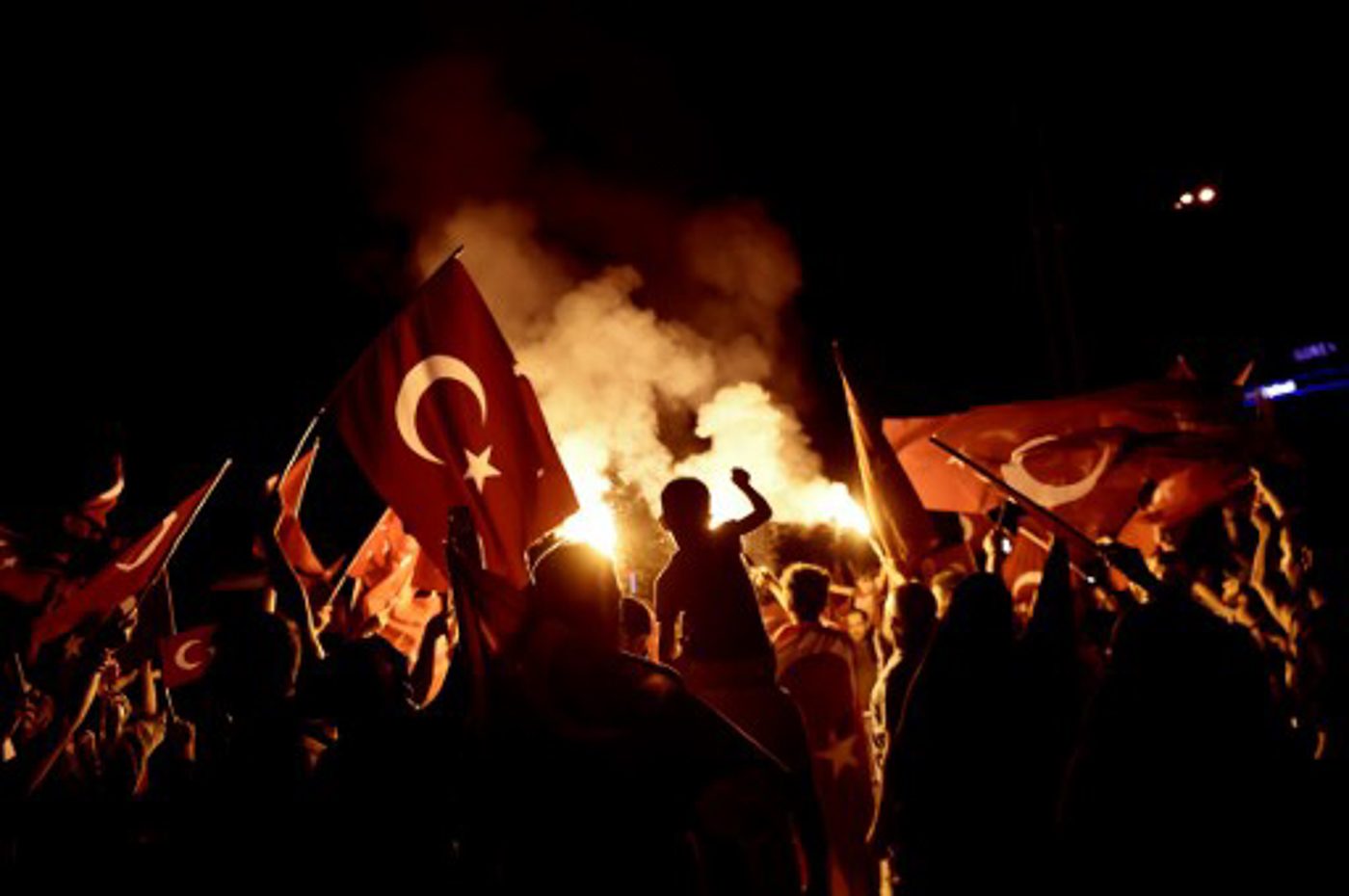 Pro-Erdogan supporters wave Turkish national flags during a rally at Taksim square in Istanbul on July 18, 2016 following the military failed coup attempt of July 15. Aris Messinis/AFP 