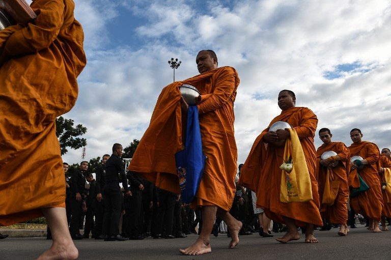 Thais mark new King’s birthday with monks, stamps