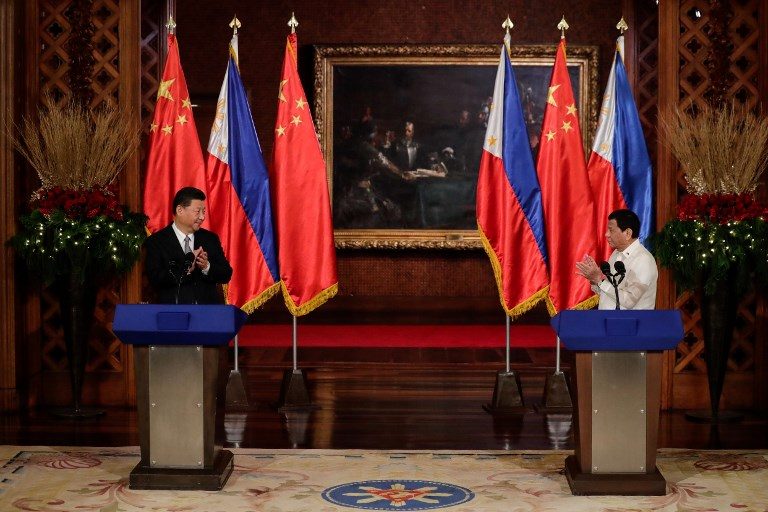 STATE VISIT. Chinese President Xi Jinping (left) and President Rodrigo Duterte react after a joint press statement at the Malacanang Presidential Palace on November 20, 2018. Photo by Mark Cristino/Pool/AFP   