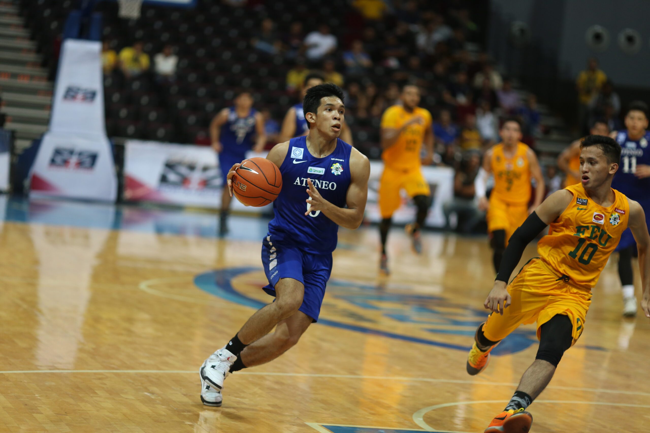 Ateneo holds on late to defeat defending champion FEU