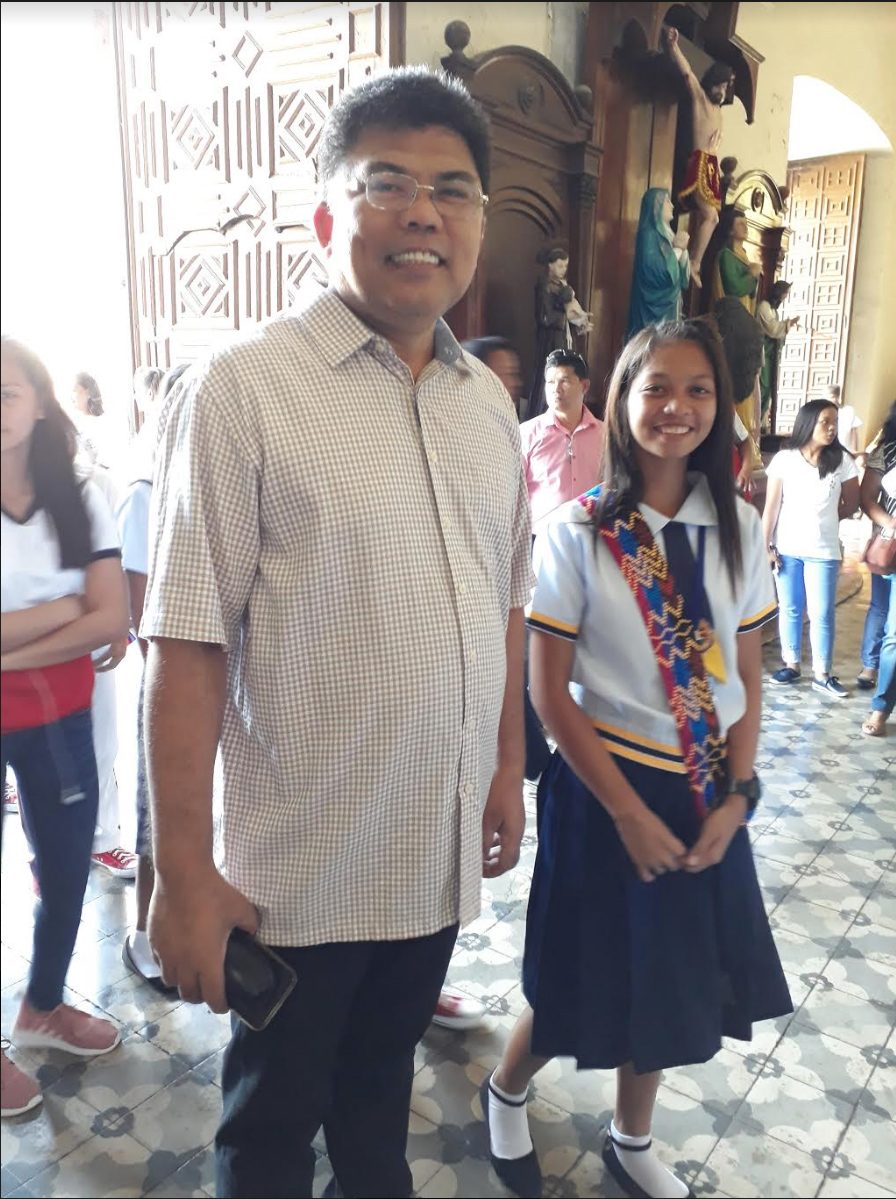 ADOPT-A-GRADUATE. Giovanni Velasco, chief of Vigan school govevernance division, is seen here with a Zamboangueño graduate he "adopted." Photo by Editha Bagcal
  