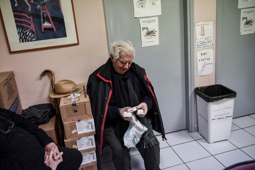 Crisis-hit Greeks foot steep bills for health, education