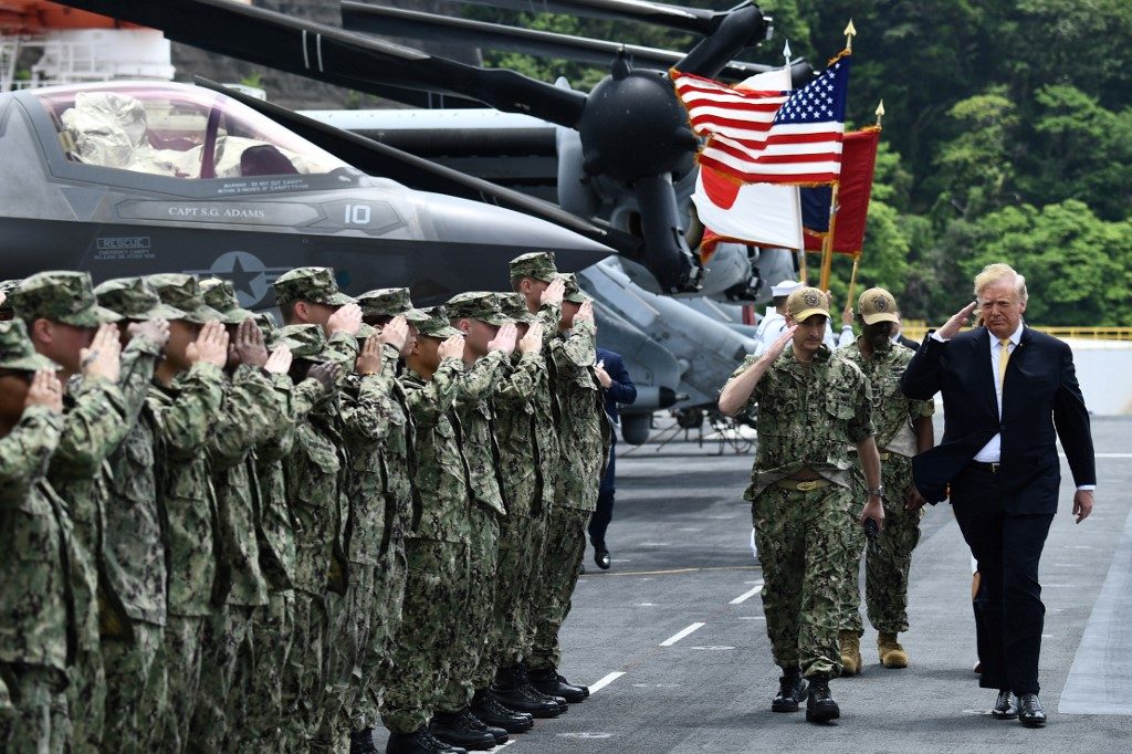 Trump bids Japanese emperor farewell, tours U.S. navy base