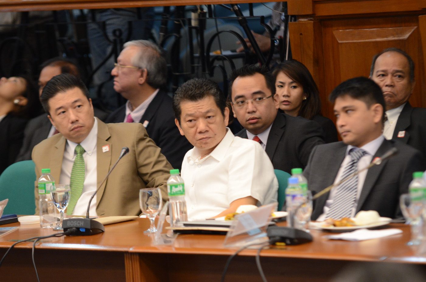BEHIND. Kristoffer James Purisima (center back) and Victor C. Fernandez (top right) lawyer for casino junket operator Kim Wong (front center). Photo by Alecs Ongcal/Rappler   