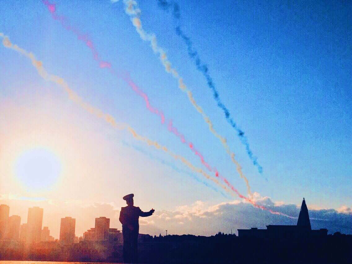 Multi-colored smoke trails. Flight formation in Pyongyang 