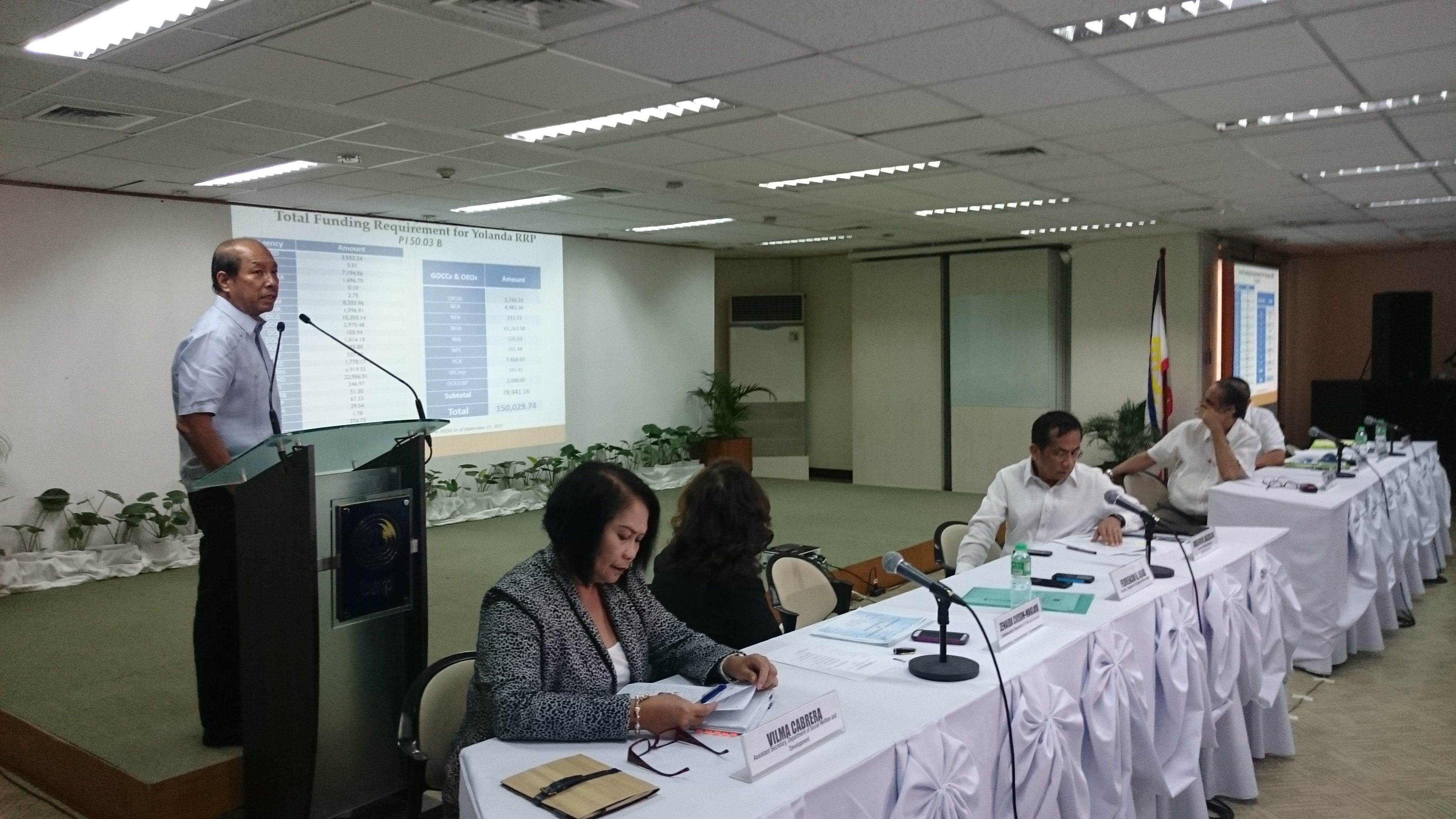 PROGRESS REPORT. Budget Secretary Florencio Abad (standing) leads the government officials from NEDA, DTI, DPWH, and NHA in outlining the Yolanda rehabilitation progress that has been made in 2 years. All Photos by Chris Schnabel / Rappler  