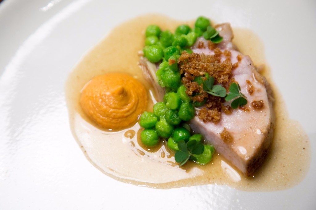 'FARM.' The porkloin, cooked to perfect tenderness, is given a new flavor dimension by the pureed chorizo. The green peas add an overall fresh creaminess to the dish. Photo by Paulo Buendia 