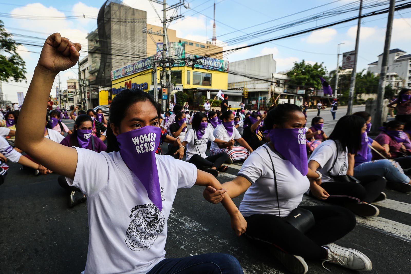 BLOCKING STREETS TO FIGHT FOR RIGHTS. The theme of the protest "women occupy space" the symbolic action aims to raise the call to block the passge of the anti terrorism bill or EO 70 in the Senate. Photo by Jire Carreon/Rappler 