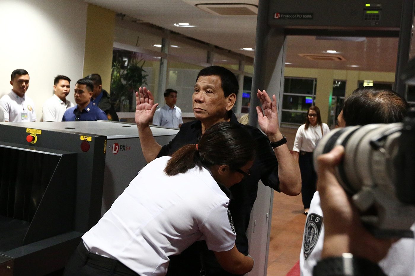 SECURITY CHECK. President Rodrigo Duterte submits himself for security inspection upon his arrival at the Bohol-Panglao International Airport for its inauguration on November 27, 2018. Malacañang photo 