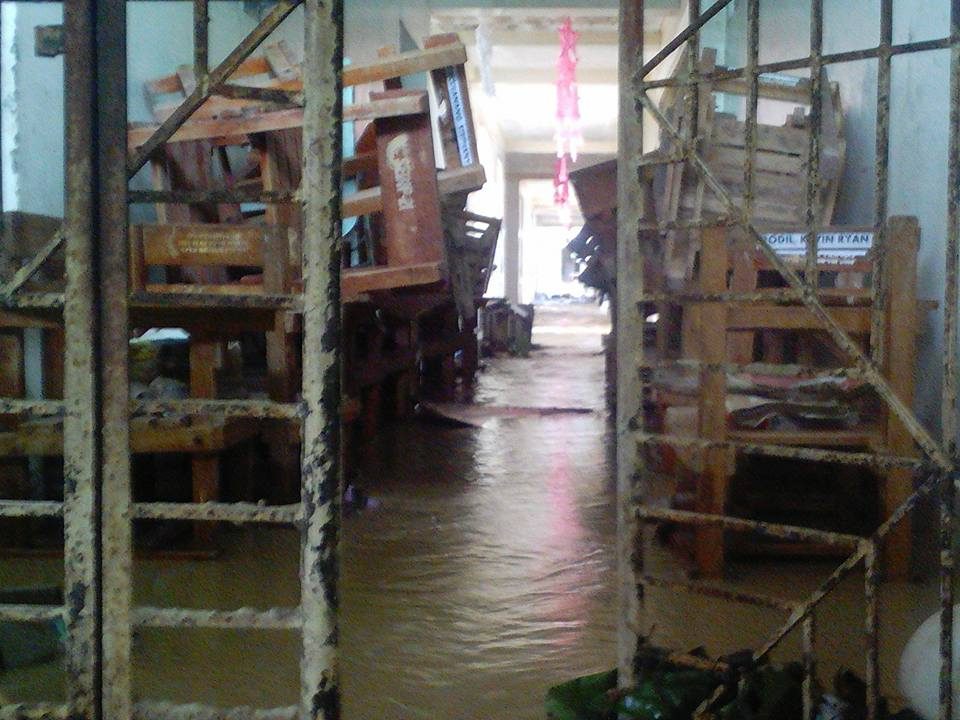 INSIDE THE SCHOOL. Chairs are stacked together in the flood-hit building of the Tucdao National High School. Photo by Rafael Medalla 