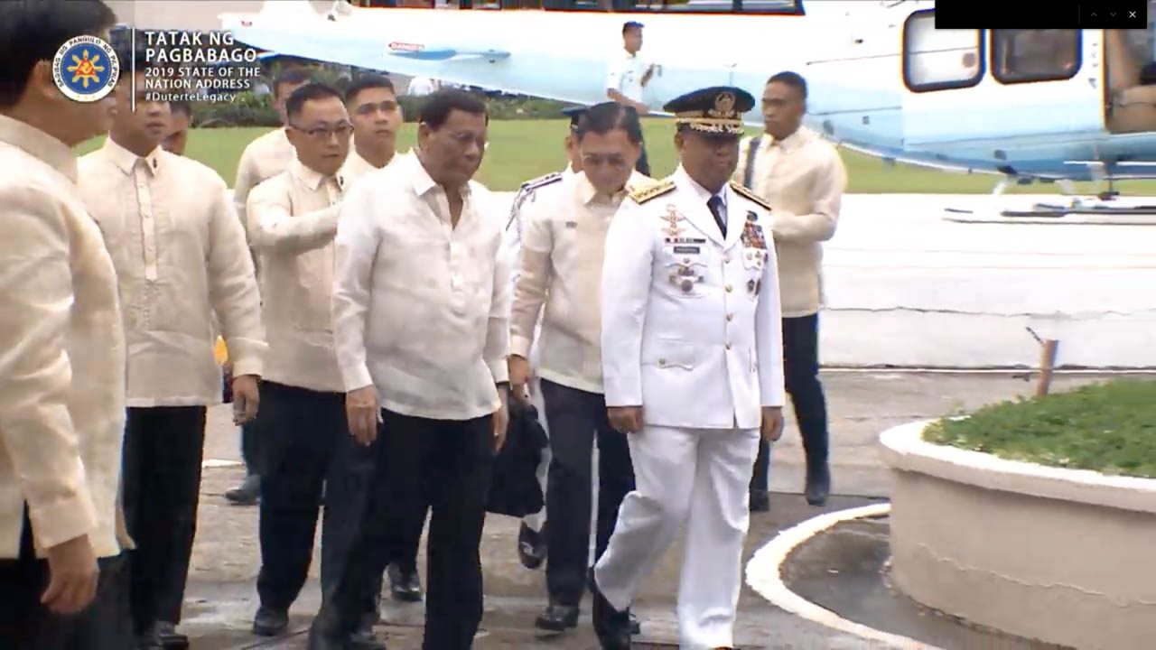 SPECIAL. Senator Bong Go welcomes President Duterte as his chopper lands at the Batasang Pambansa. RTVM screenshot 