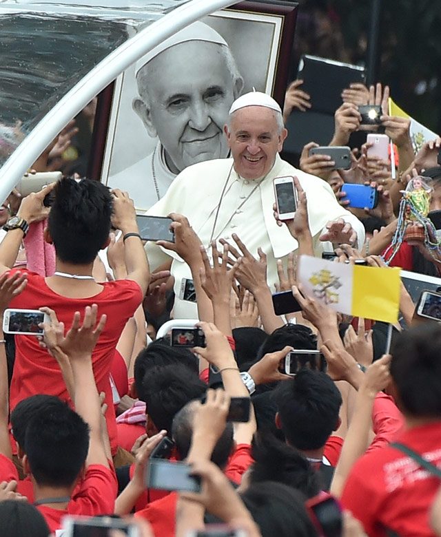 Pope Francis is greeted by the youth at the Pontifical and Royal University of Santo Tomas in Manila on January 18, 2015. Photo by Ettore Ferrari/EPA