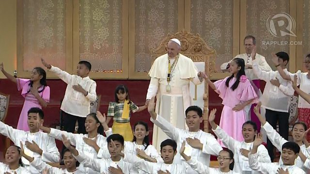 Pope Francis watches as youth sing 'Tell The World of His Love' at the University of Santo Tomas. 