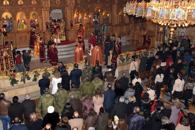 ALEPPO. Upacara perayaan Hari Natal di Elias Orthodox Church, Aleppo, Suriah. Foto oleh George Ourfalian/AFP 