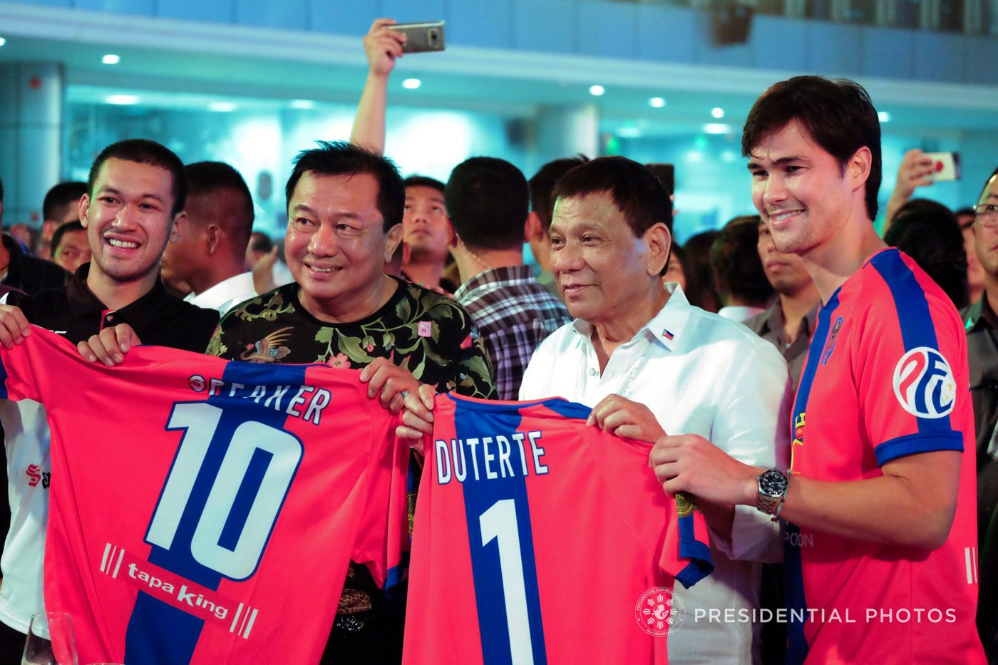 Alvarez and Duterte receive honorary jerseys from Davao Aguilas football player Phil Younghusband during the House Speaker's birthday celebration at the New Tagum City Hall in Davao del Norte. Malacañan photo  