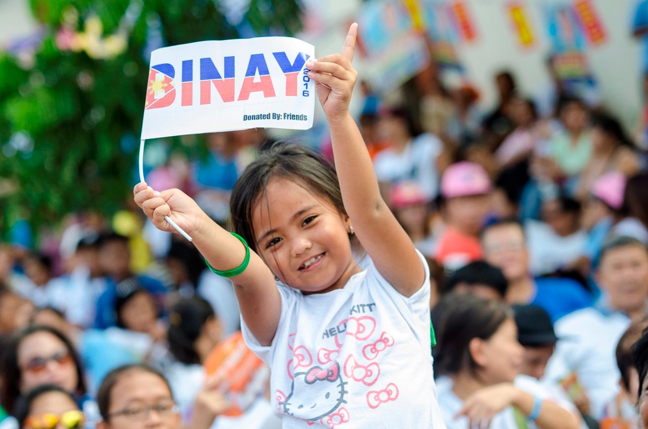 LITTLE SUPPORTER. A young girl waves a Binay flag to show her support for the Vice President. 
