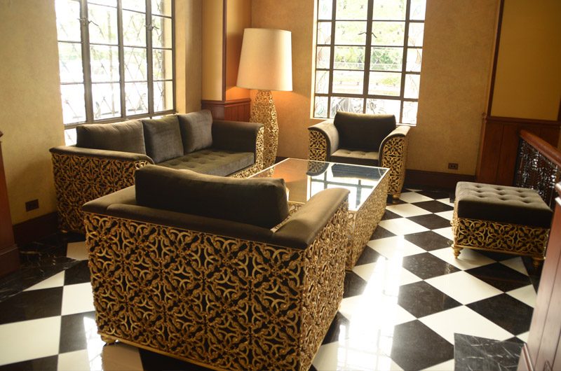 THE LOBBY. Gilded furniture adorns the intimate reception area. Photo provided by Luneta Hotel