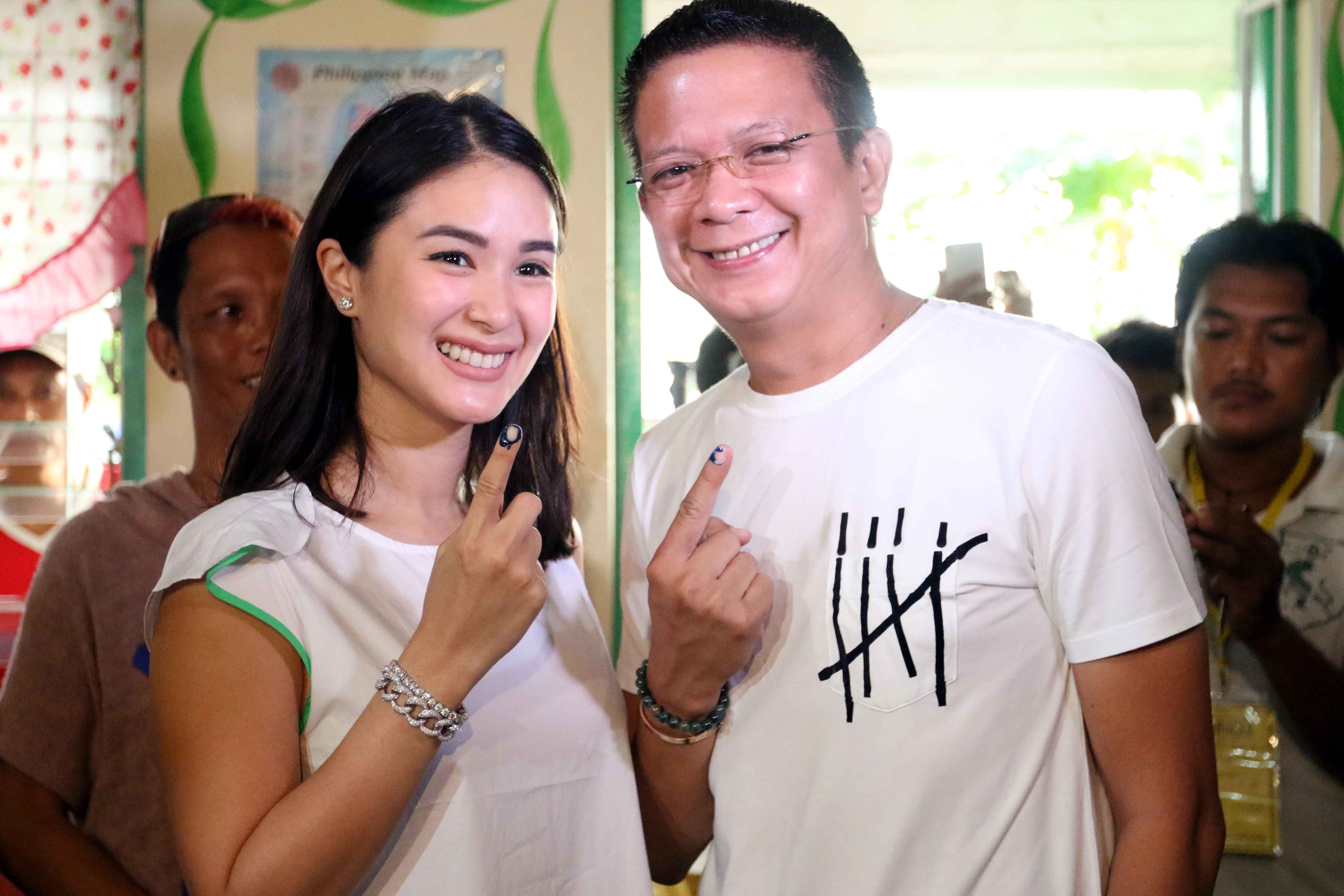 Candidate for Vice President Senator Chiz Escudero and wife Heart Evangelista display the ink marks on their fingers after voting in Buhatan Intergrated National School in Sorsogon. Photo by Arnold Almacen/Poe-Escudero Media Bureau 