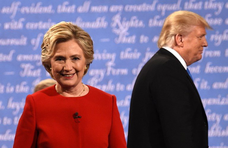 Clinton edges ahead of Trump in post-debate poll bump