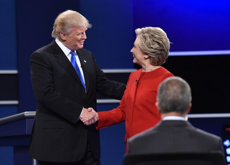CIVIL. Democratic nominee Hillary Clinton (R) shakes hands with Republican nominee Donald Trump during the first presidential debate at Hofstra University in Hempstead, New York on September 26, 2016. Paul J. Richards/AFP 