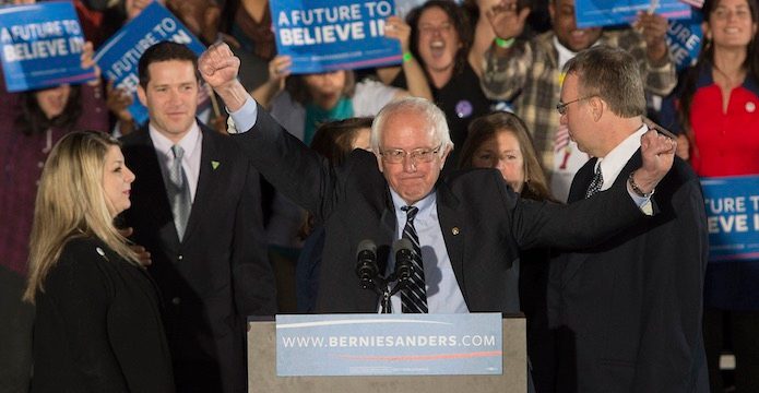 NEW HAMPSHIRE WINNER. US Senator and Democratic Presidential hopeful Bernie Sanders (C) pumps his fists up during his victory speech to supporters at Concord High School in Concord, New Hampshire, USA, February 9, 2016. CJ Gunther/EPA 
